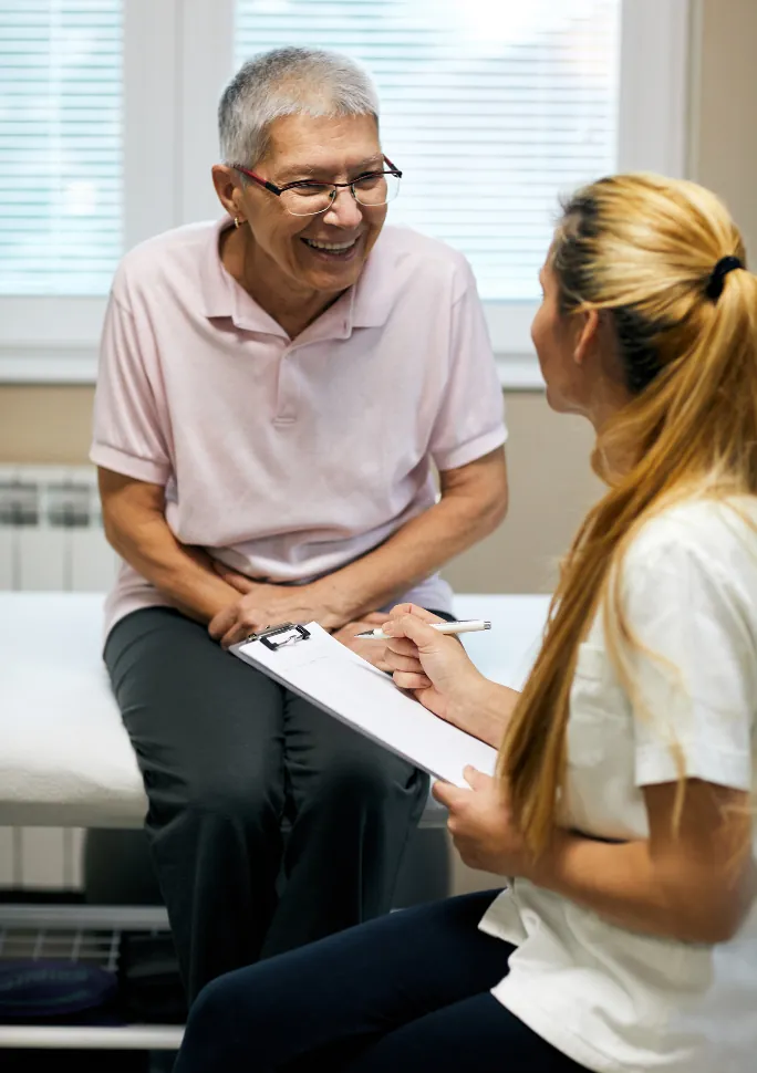Physical therapist talking through an evaluation with a patient