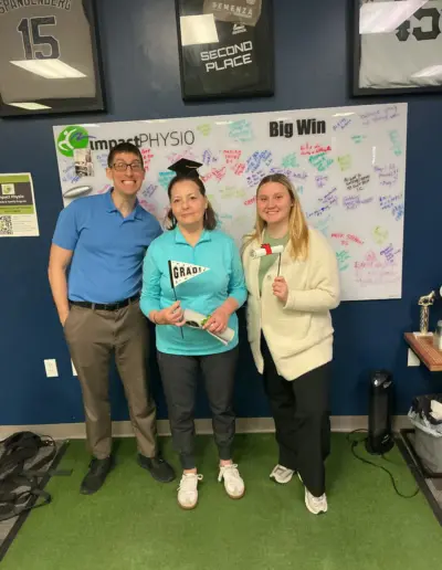 Impact Physio patient celebrating a return-to-sport milestone with the care team